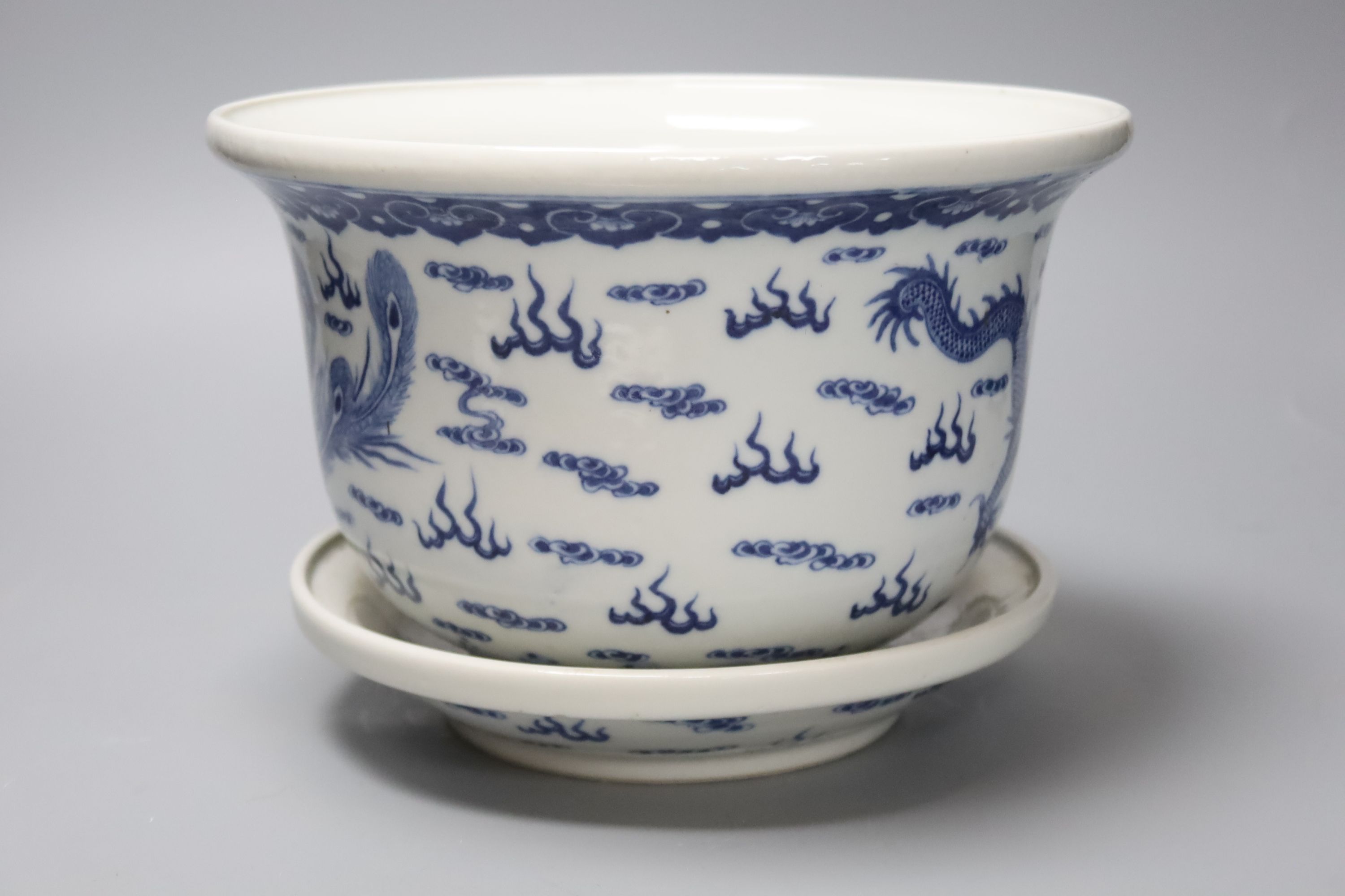 A 19th century Chinese porcelain jardiniere on stand